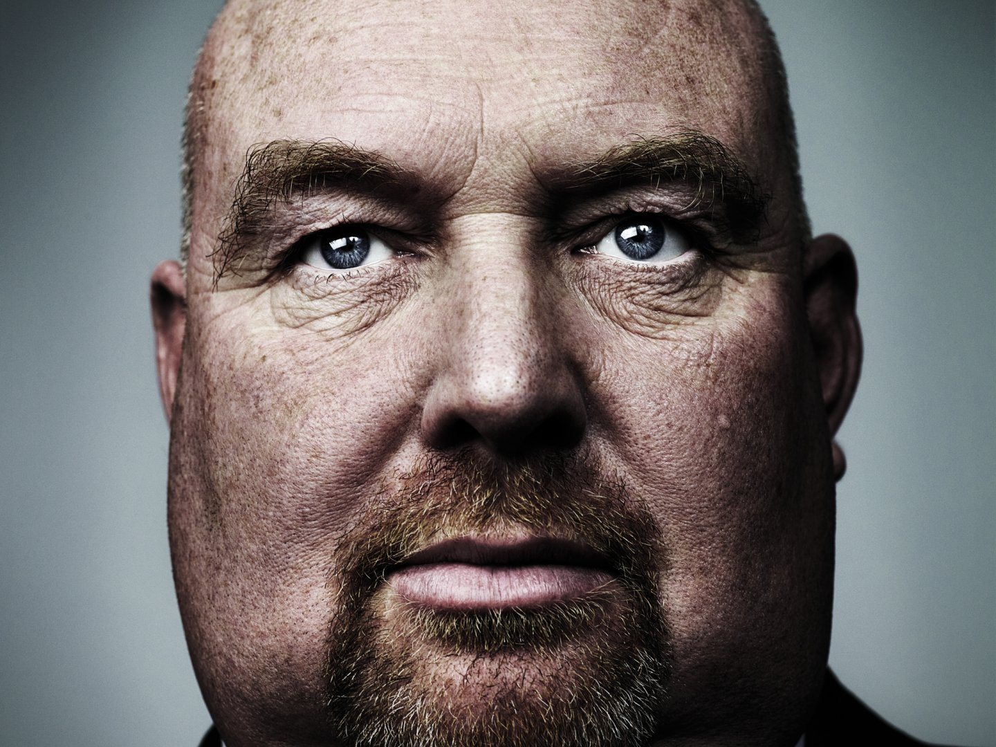 John Pridmore looks straight into the camera, unsmiling